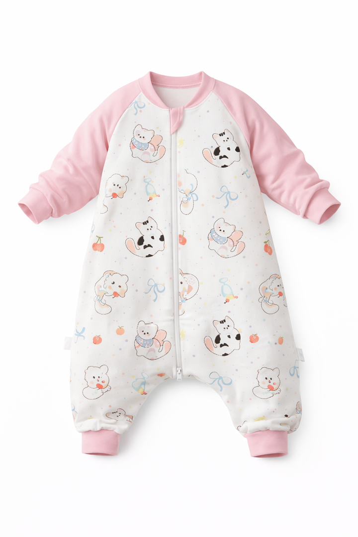 Toddler walking in a pink 1.5 TOG sleeping bag with feet.